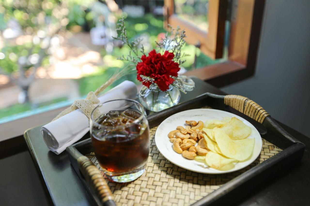 The Raweekanlaya Bangkok Kültér fotó A glass of Oolong tea